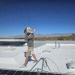 man doing roof inspection